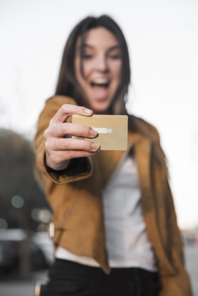 amazed-young-lady-with-plastic-card